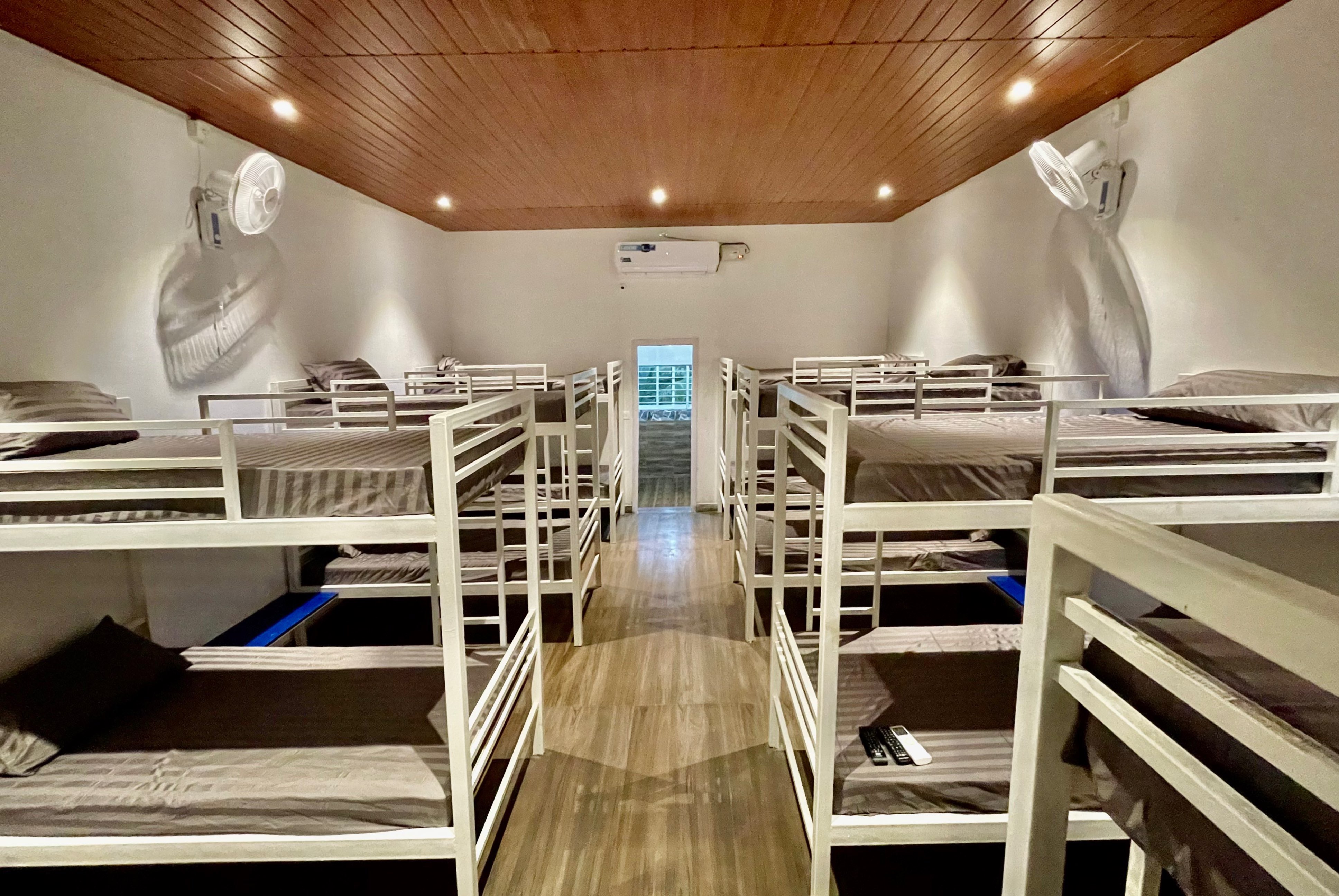 Spacious and well furnished dormitory with cozy beds, interiors, & relaxing ambiance for groups.